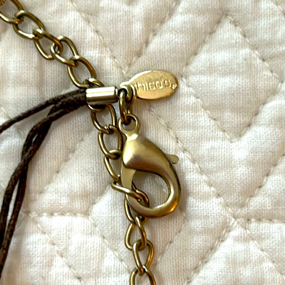Chico’s three strand necklace with gold and various shades of brown beads. - Picture 2 of 4